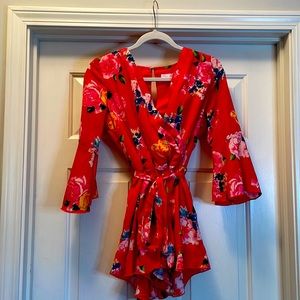 Pink Lily floral romper. Size small. Reg $46.